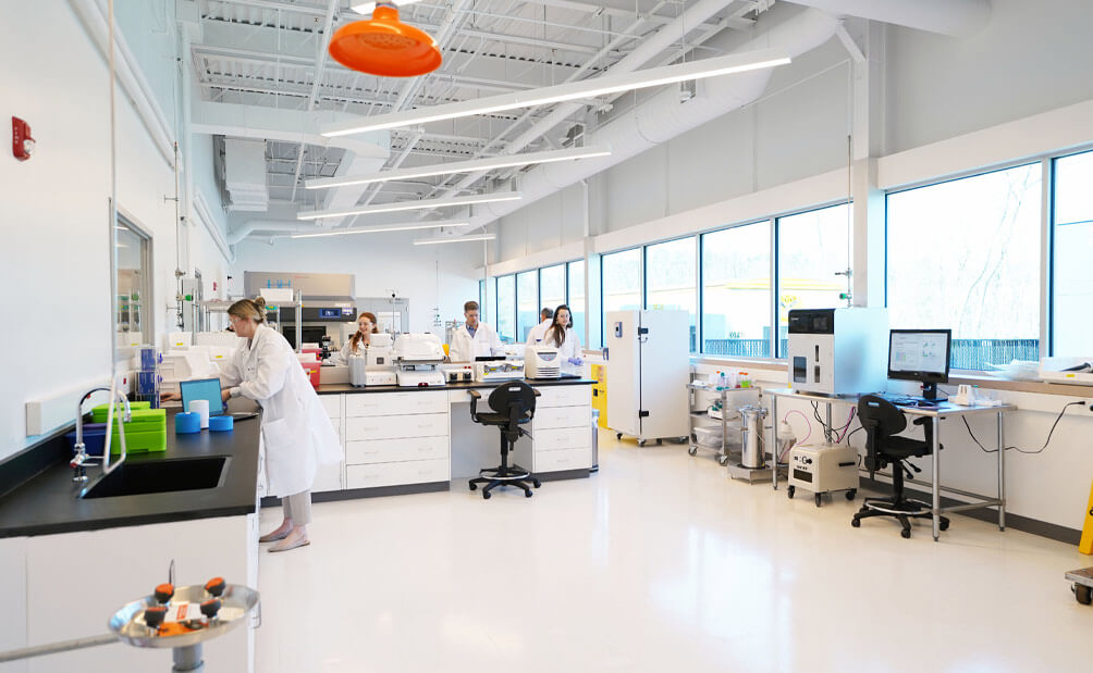 inside of lykan bioscience lab with employees