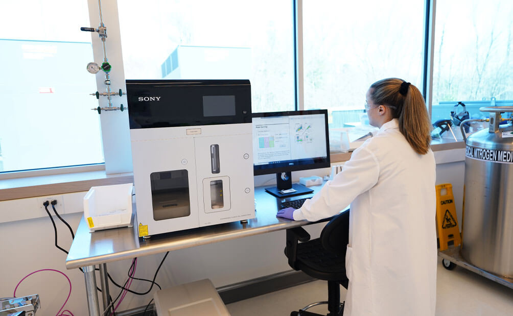 Female Lykan professional analyzing computer data