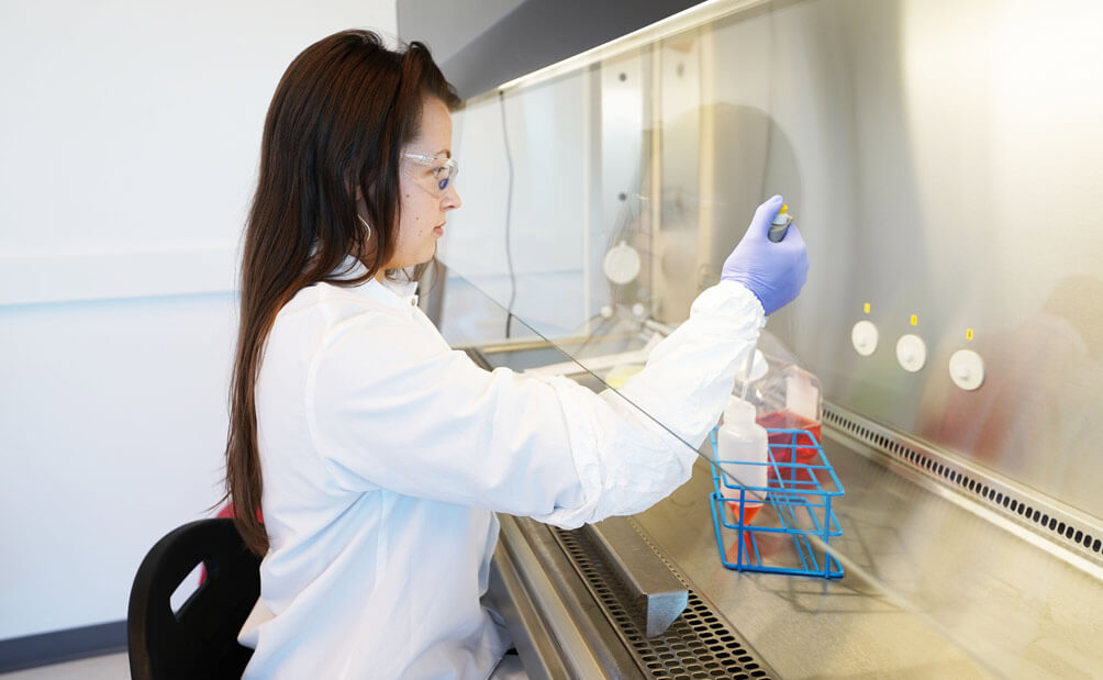 Female scientist testing materials