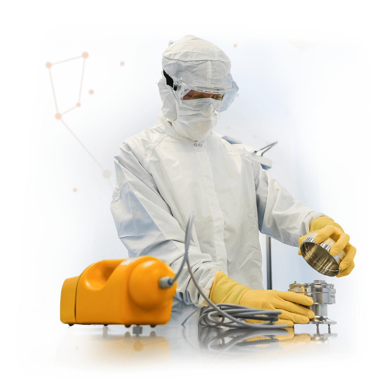 Scientist in gown and yellow gloves
