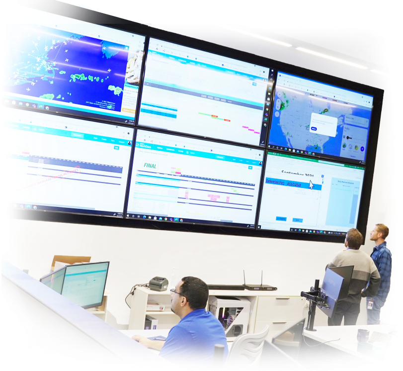 Lykan employees looking at screens at the command center