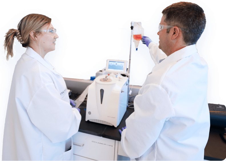 Scientists analyzing materials in lab