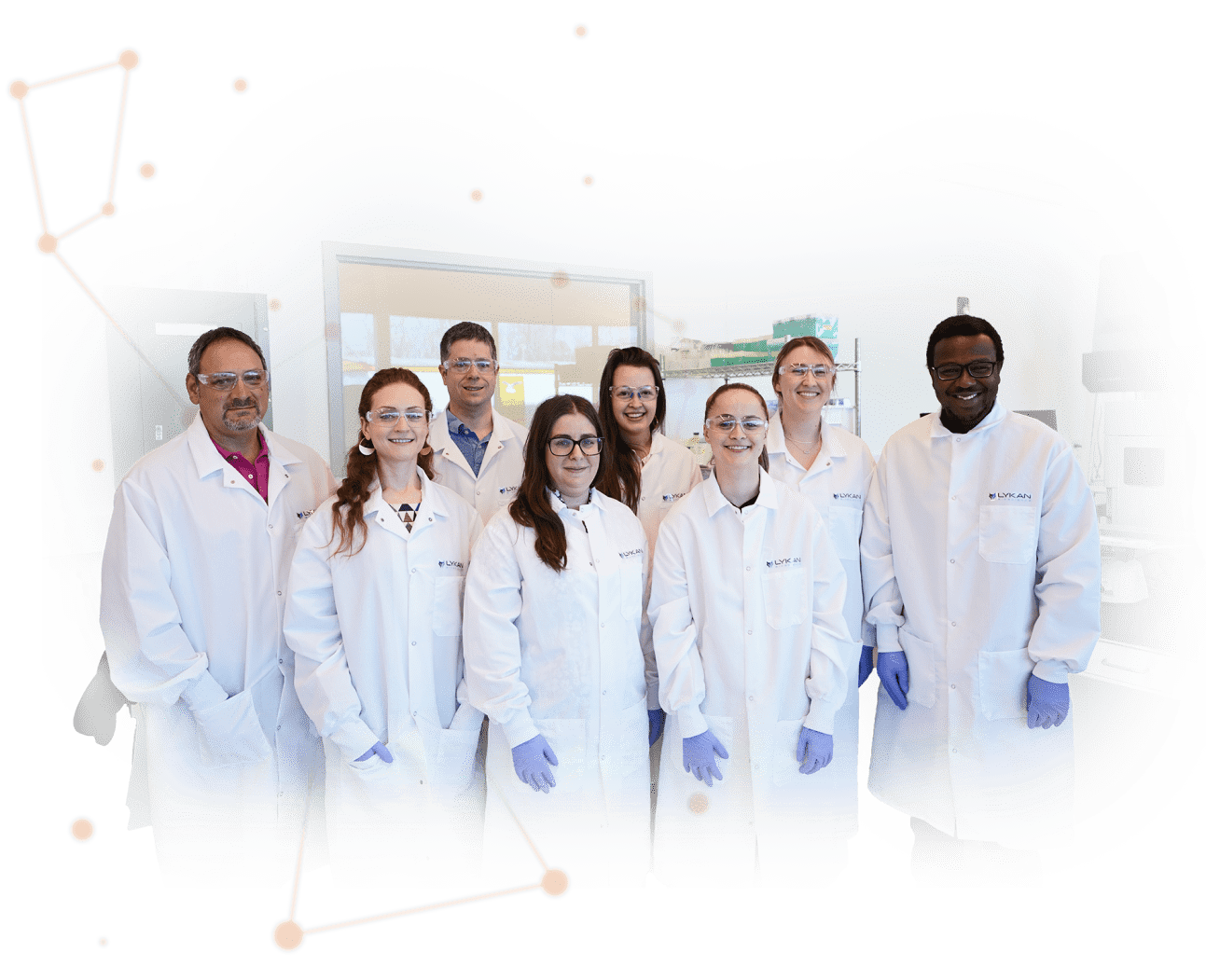 cutout image of team of Lykan professionals in gowns