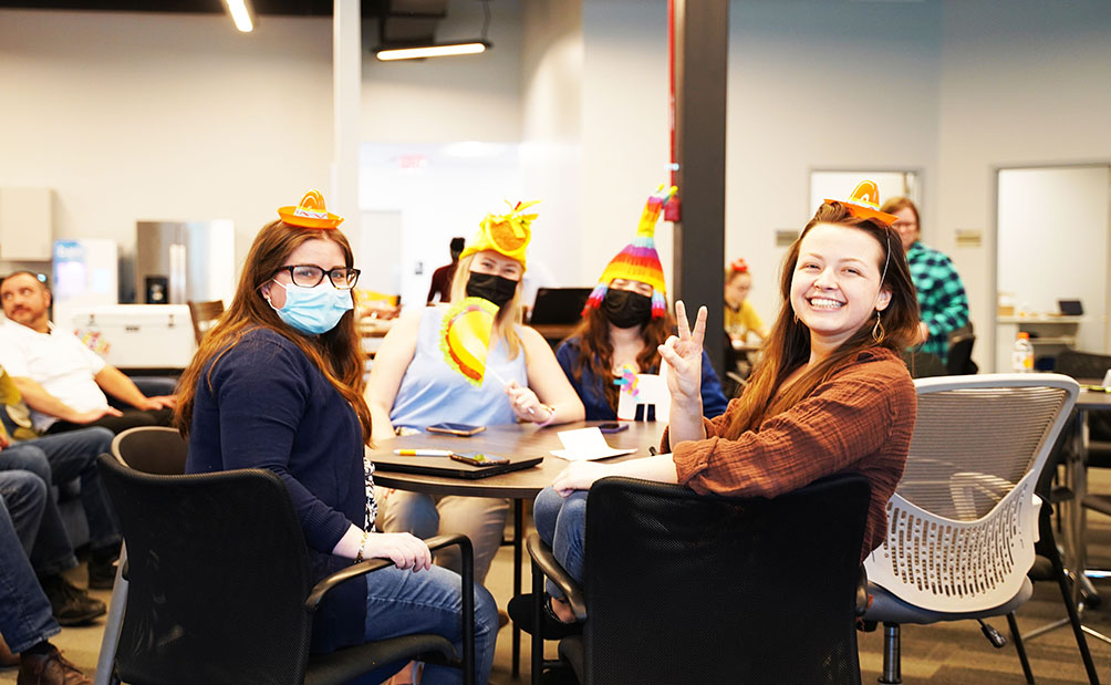 Happy Lykan employees at a party.